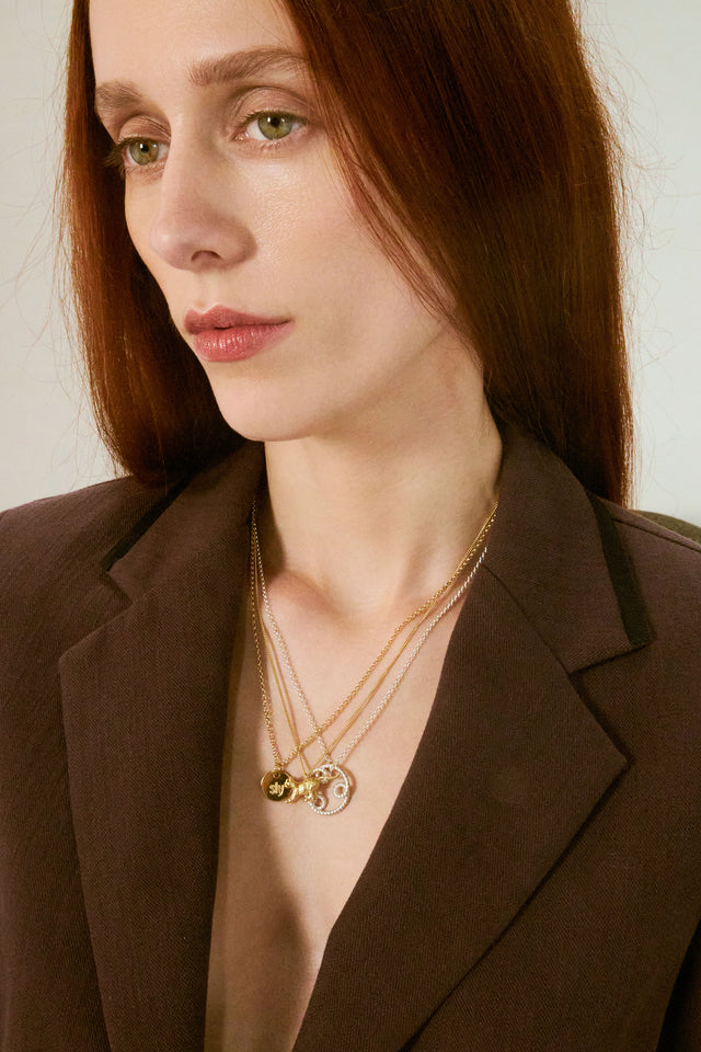 Sly pendant necklace