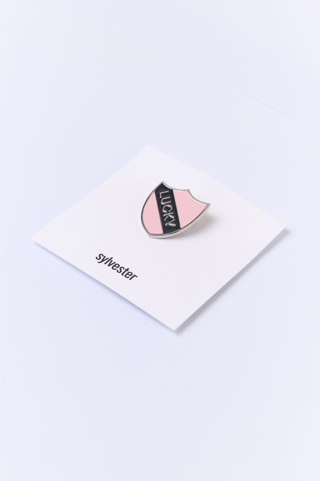 Lucky shield pin
