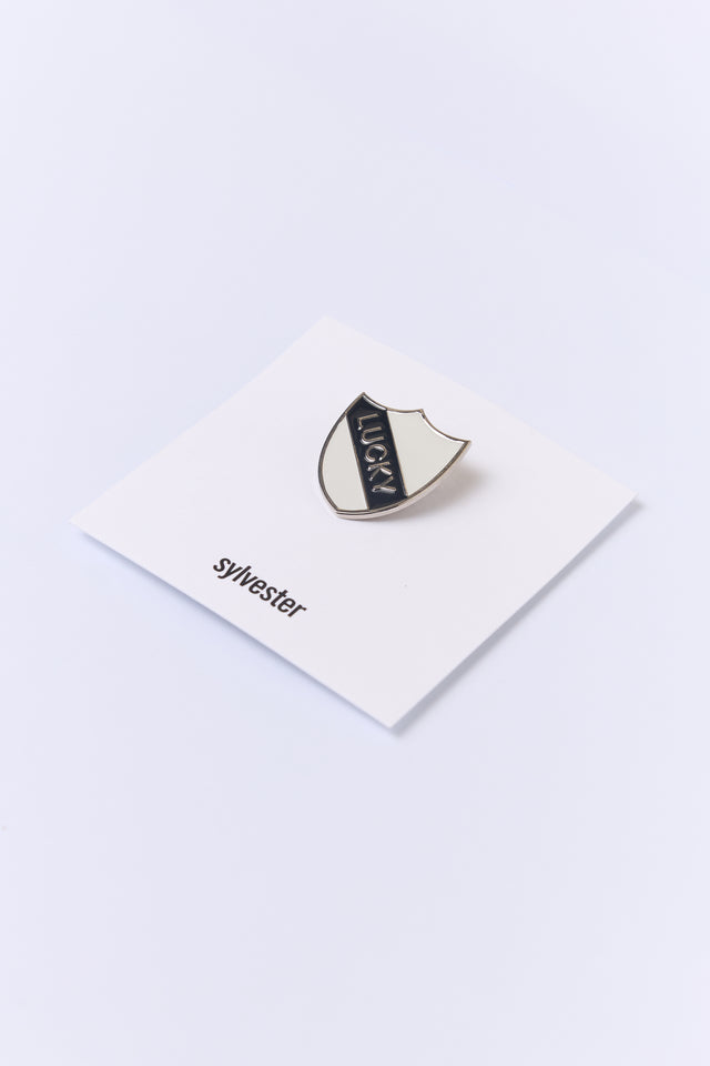 Lucky shield pin