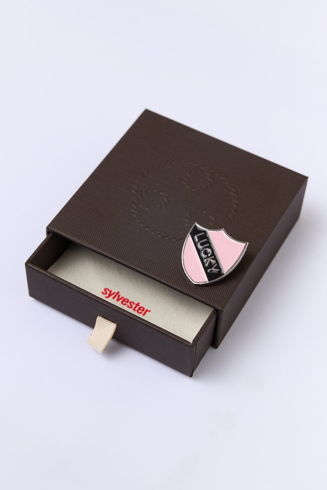 Lucky shield pin