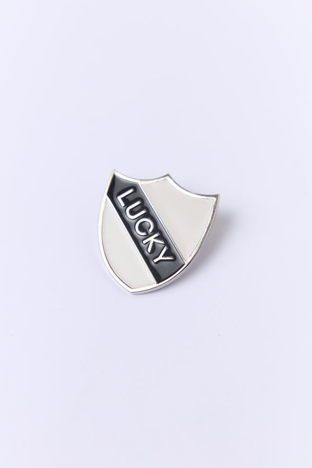 Lucky shield pin